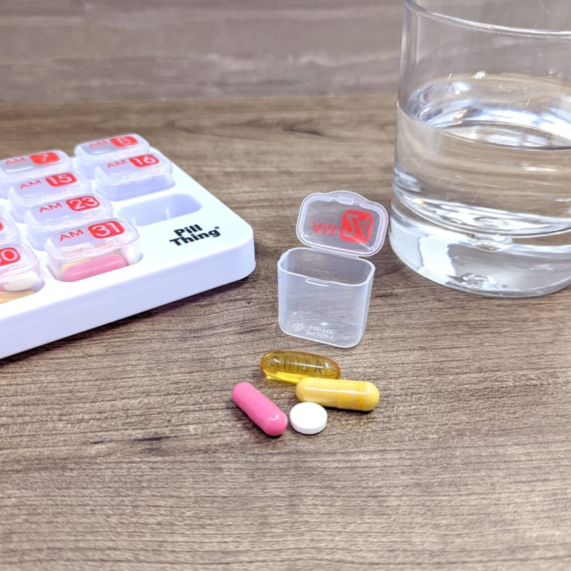 Organized medication and supplements for a busy professional's daily routine