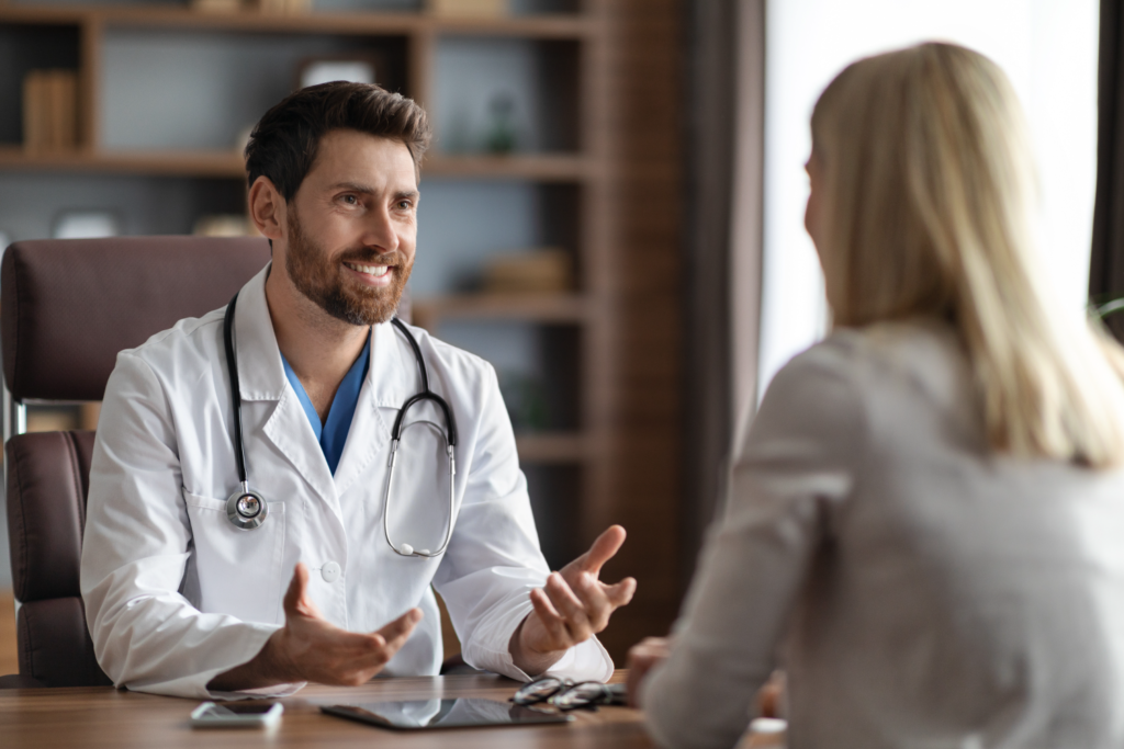 Medical professional explaining mounjaro cost with insurance to a patient in a clinic