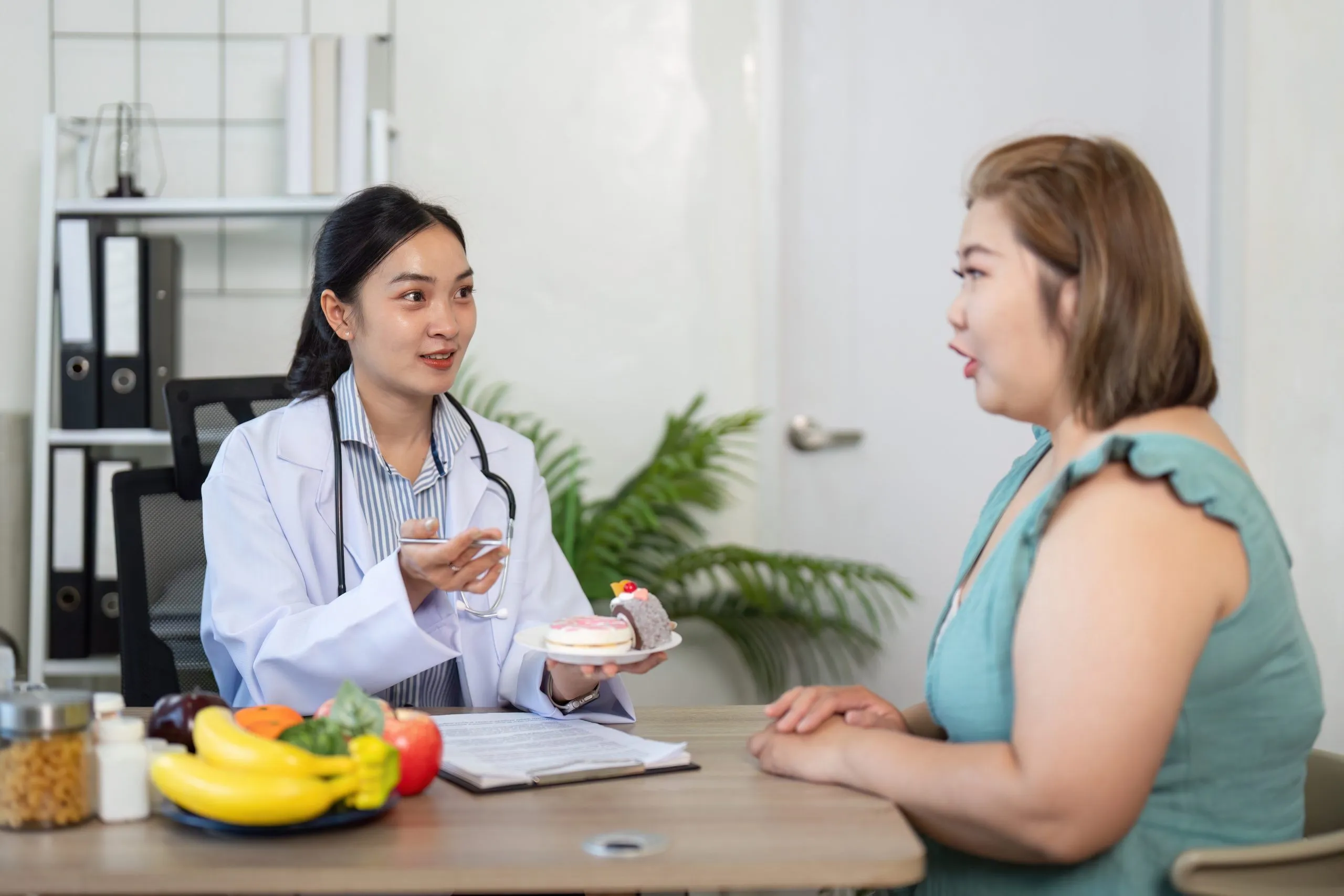 Healthcare professional providing orlistat nhs medical slimming advice for weight management.